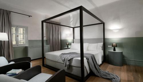 Letto o letti in una camera di ATHINAIDOS QUARTERS by K&K
