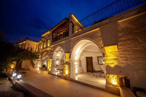 a building with lights on it at night at FARMER CAVE HOUSE in Ürgüp