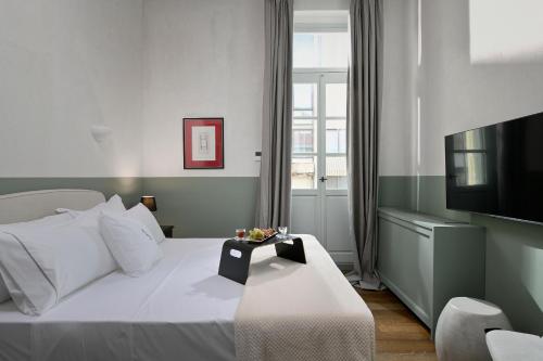 Letto o letti in una camera di ATHINAIDOS QUARTERS by K&K