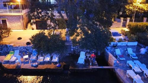 an aerial view of a group of chairs and tables at Montenegro Apartmant's in Kotor