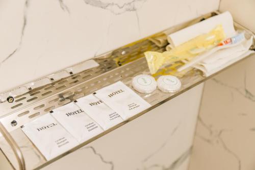 a shelf in a bathroom with some items on it at RUSH BUTIK in Atyraū