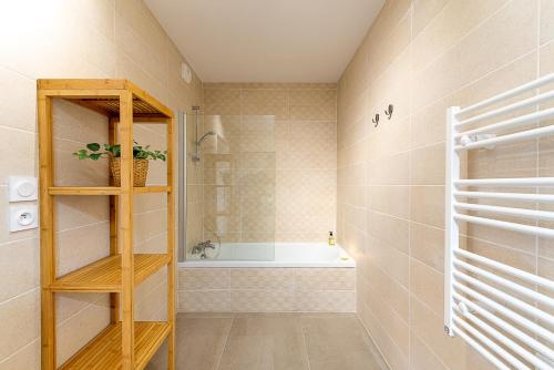a bathroom with a shower and a bath tub at Aux balcons annéciens- Entre Lac et centre ville, LLA Selections by Location lac Annecy in Sévrier