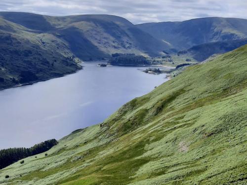 a view of a lake in the middle of a hill at Haweswater Cottage in Bampton