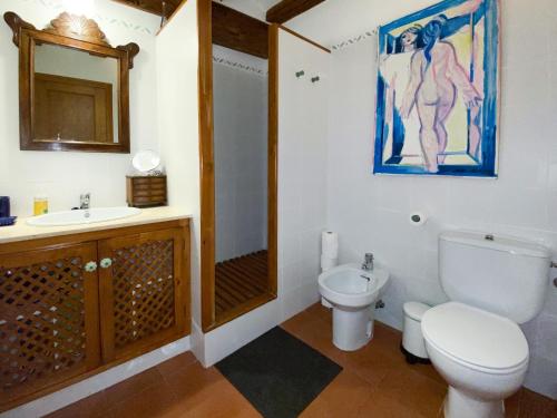 a bathroom with a toilet and a sink and a shower at Cal Manso in Arnés