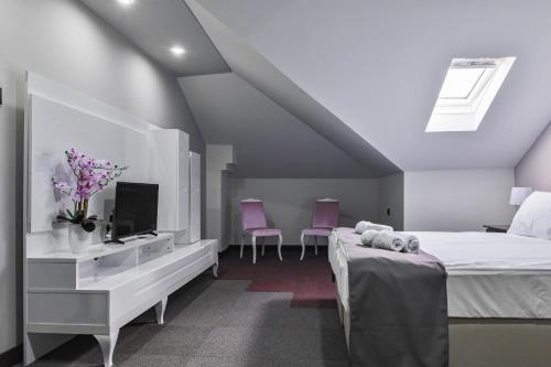 Postel nebo postele na pokoji v ubytování Garni Hotel Aline