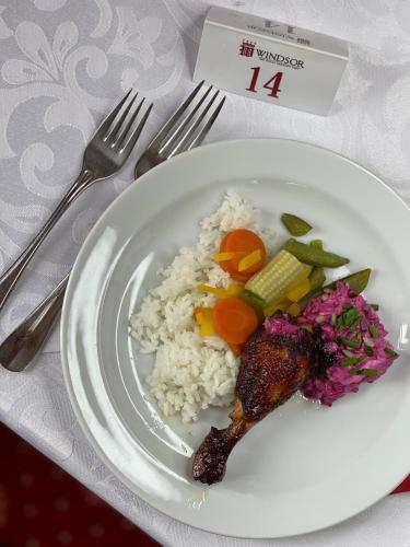 a plate of food with rice and vegetables on a table at WINDSOR SPA Hotel in Karlovy Vary