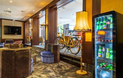 a hotel lobby with a bicycle on the wall at tinyTwice Hotel Bonn in Bonn