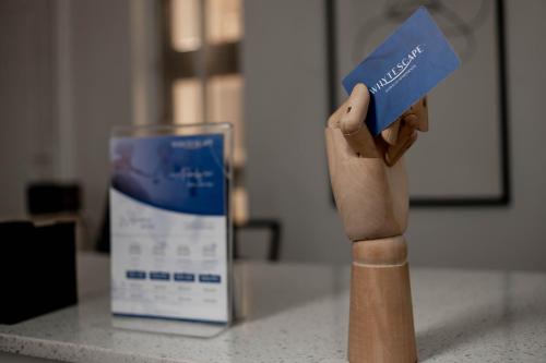 a wooden person holding up a calendar at Whytescape Serviced Apartments in Abuja