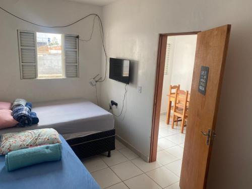 Katil atau katil-katil dalam bilik di Residencial pimenta - aluguel temporada - apto mobiliado
