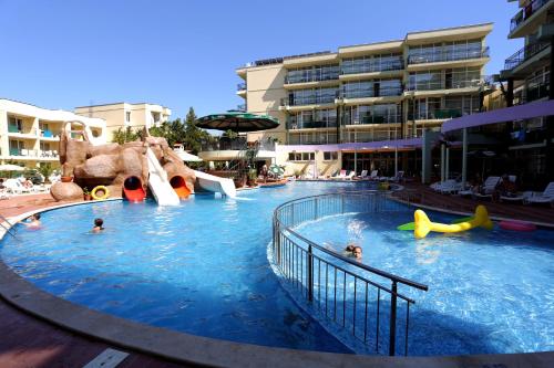 a large swimming pool with people in a resort at Sunny Day Club Hotel in Sunny Beach
