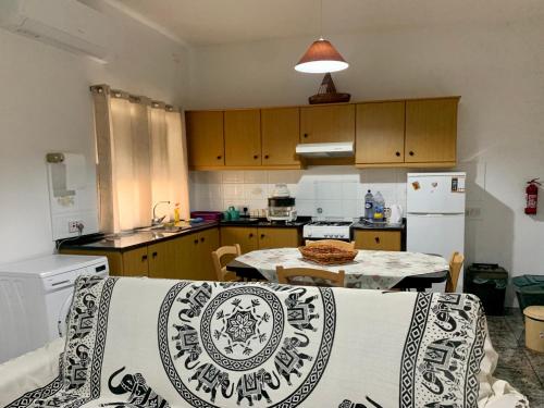 a kitchen with a couch and a table in it at 2 Bedroom Appartment Birzebbugia in Birżebbuġa