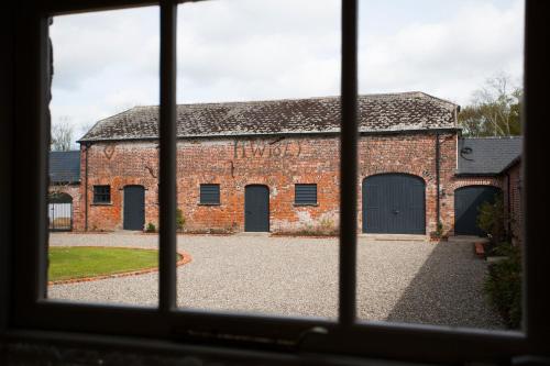 a view of a brick building from a window at Clonganny House in Ballygarrett