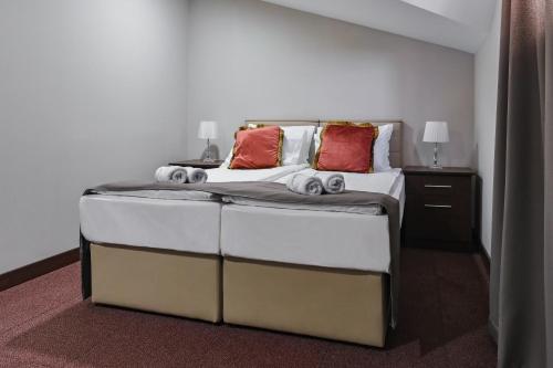 Postel nebo postele na pokoji v ubytování Garni Hotel Aline