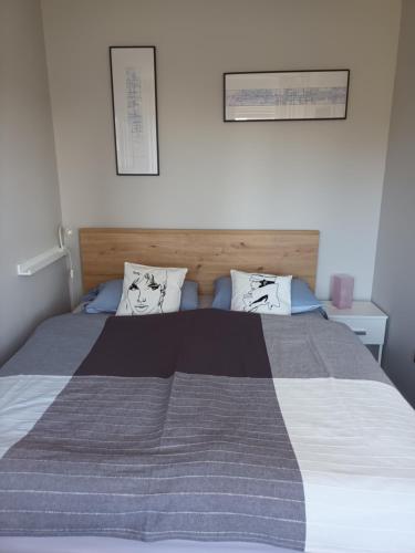 a bedroom with a large bed with two pillows at NEW - Frendly Luxury Apartment Franka Zagreb in Zagreb