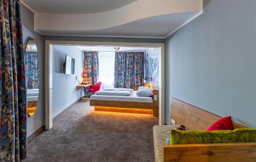 a hotel room with a bed and a window at tinyTwice Hotel Bonn in Bonn