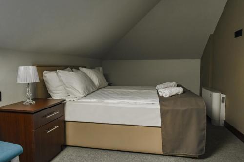 Postel nebo postele na pokoji v ubytování Garni Hotel Aline