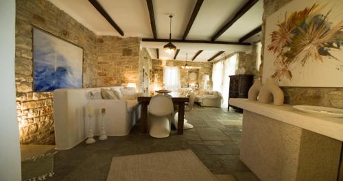 a bathroom with a sink and a table in a room at Dream Villa Santa Maria in Santa Maria