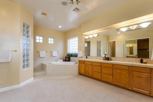 a large bathroom with a tub and a sink at Casa Highland home in Fountain Hills