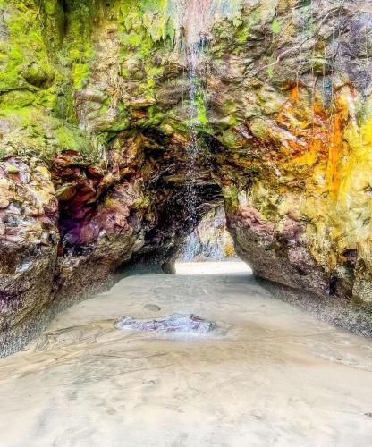 a painting of a cave on the beach at PlazaMar Pacifico Hotel in Buenaventura