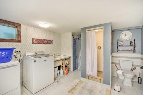 a bathroom with a toilet and a sink at Elegant Superior Getaway Less Than 2 Mi to Downtown! in Superior