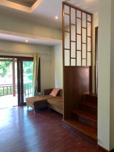 Postel nebo postele na pokoji v ubytování บ้านธานี (BAAN THANI)