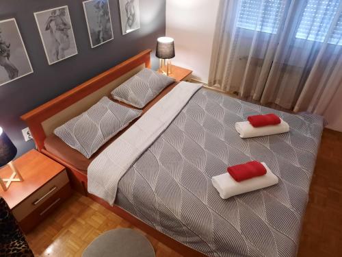 Postel nebo postele na pokoji v ubytování Apartman RIGEL