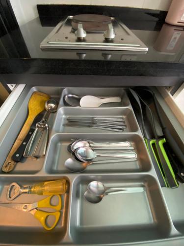 a drawer filled with utensils in a refrigerator at The Base in pattaya in Pattaya Central