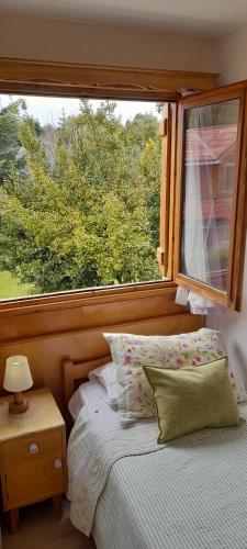 Postel nebo postele na pokoji v ubytování Hosteria Katy