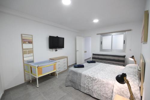 Postel nebo postele na pokoji v ubytování Apartment El Medano Sunset II