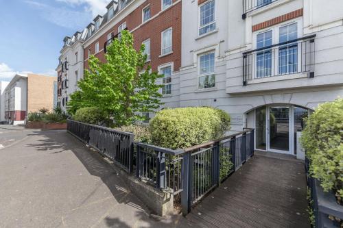 a wooden walkway in front of a building at Roomspace Serviced Apartments - Central Walk in Epsom