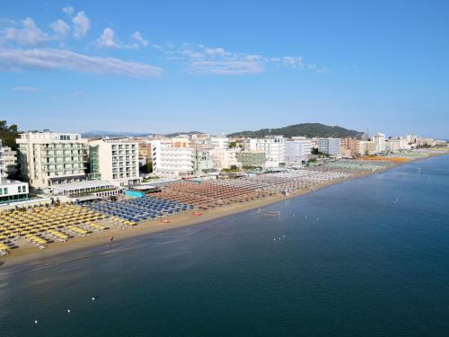 an aerial view of a beach with buildings and the ocean at Nautilus Family Hotel in Pesaro