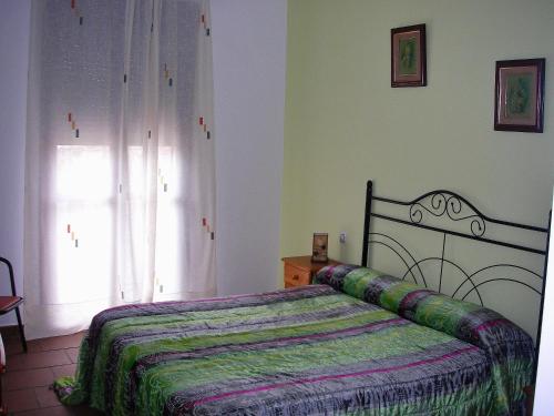 Posteľ alebo postele v izbe v ubytovaní Hotel Rural El Cuco