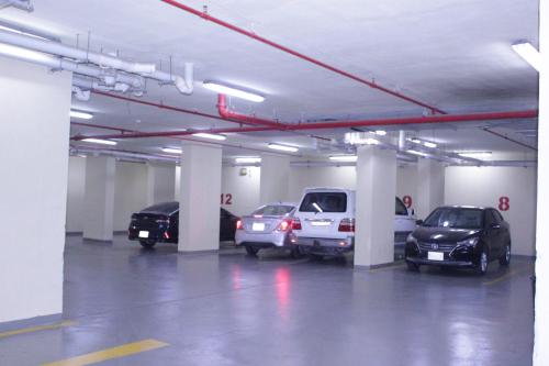 a parking garage with several cars parked in it at التميز الراقي - السليمانية in Jeddah