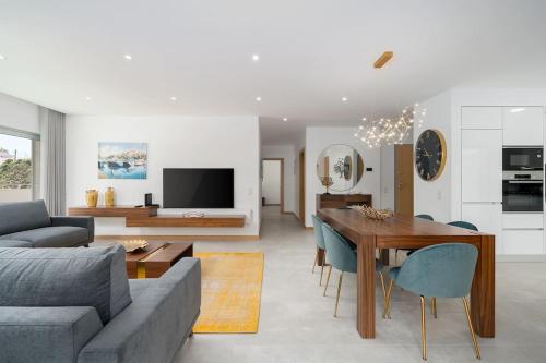 a living room with a couch and a dining room table at Lagos luxury new 2 bedroom apartment built 2022 in Lagos