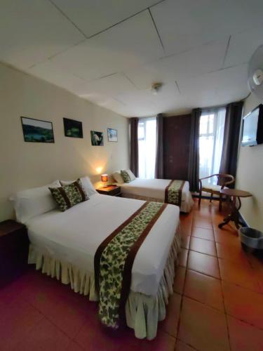 Un ou plusieurs lits dans un hébergement de l'établissement Hotel Casa Tago