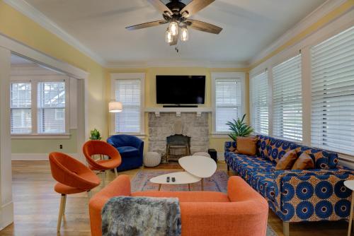 a living room with a couch and a fireplace at Spacious 3BR Cooper-Young Bungalow - Sleeps 8 - Walkable to Dining - Easy Access to Downtown - Parking in Memphis