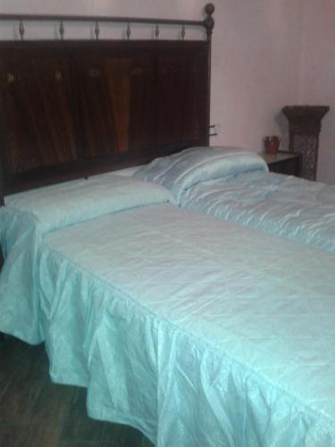 Postel nebo postele na pokoji v ubytování B&B Le Due Rocche