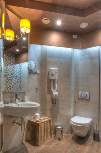 a bathroom with a sink and a toilet at Hotel Forza Mare in Kotor