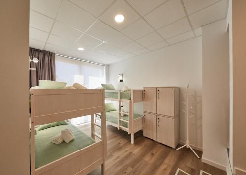 Voodi või voodid majutusasutuse ALBERGUE SEGUE O CAMIÑO toas