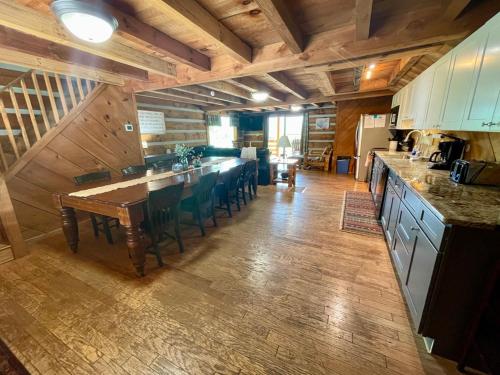 a kitchen with a table and chairs in a room at Lodge at Bradley Mtn in Townsend