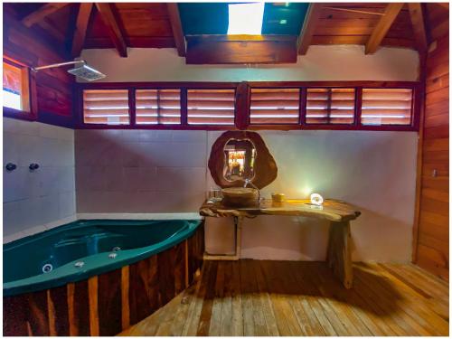 a bathroom with a bath tub in a room at Casa Paraiso Hotel Boutique in Puerto Escondido