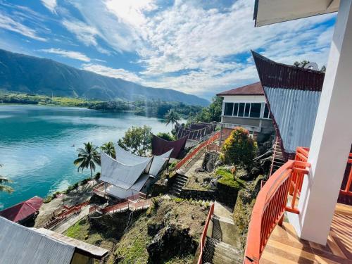 a view of a lake from a house at Vandu's View Guest house & Restaurant in Tuk Tuk