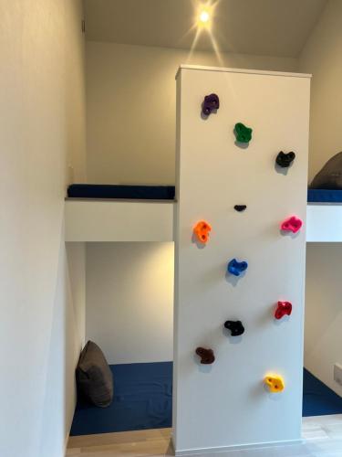 a bunk bed room with shoes on the wall at Villa Mariso “貸別荘マリソ“ in Noma