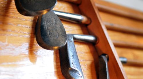 a group of knives sticking out of a wooden box at Royal Marine Hotel in Brora