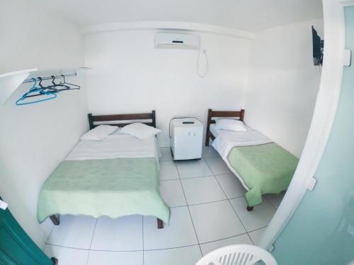 Postel nebo postele na pokoji v ubytování HOTEL MORADA DO SOL