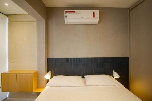Cama o camas de una habitación en Studio Próximo a Av Paulista com Piscina no Rooftop e Sauna - Belint 02