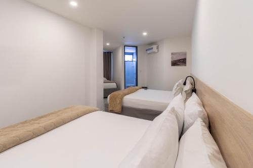 Uma cama ou camas num quarto em Bianco Hotel Boutique