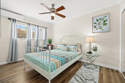a bedroom with a bed and a ceiling fan at Bright & Cozy Getaway-10min to Downtown LA in Alhambra