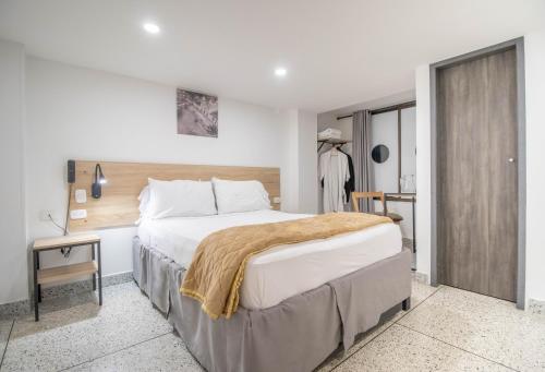 a bedroom with a large bed in a room at Bianco Hotel Boutique in Cúcuta