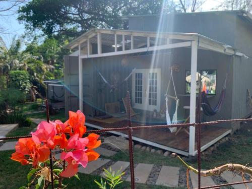 a house with a painting on the side of it at Wabi Sabi , casa de playa in Tamanique